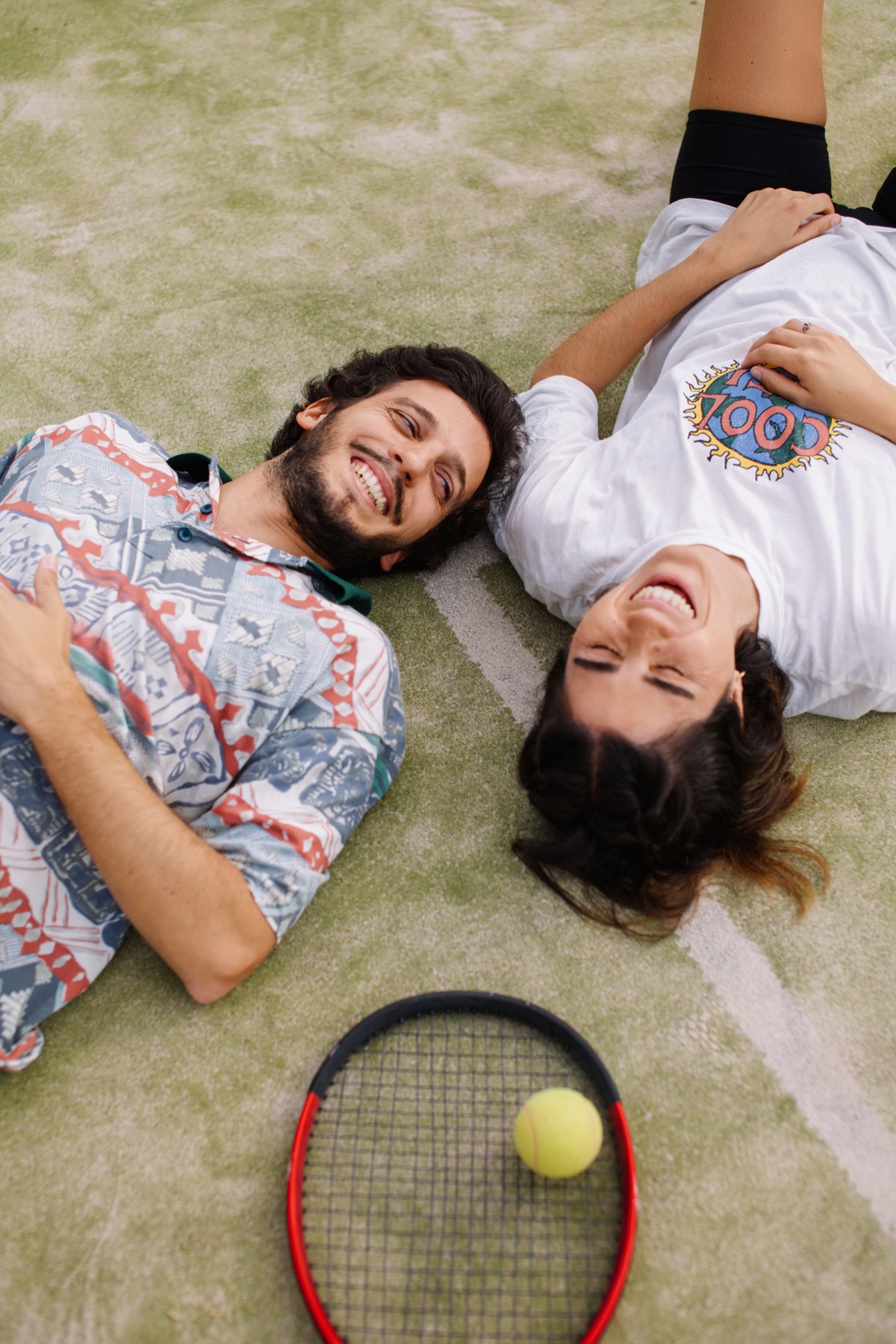 People lying on grass outdoors